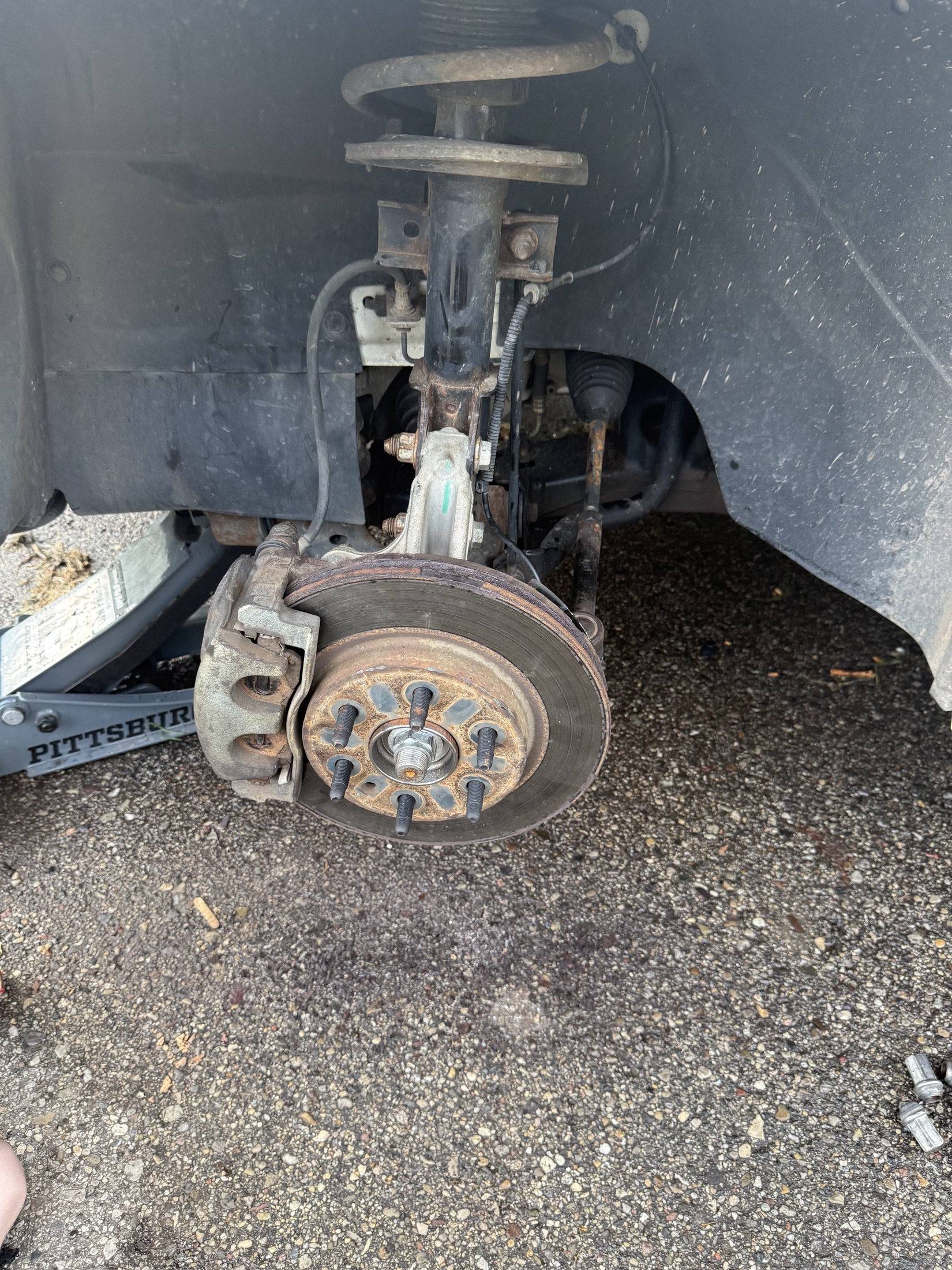 Brake service work photographed during a Solid Ground project