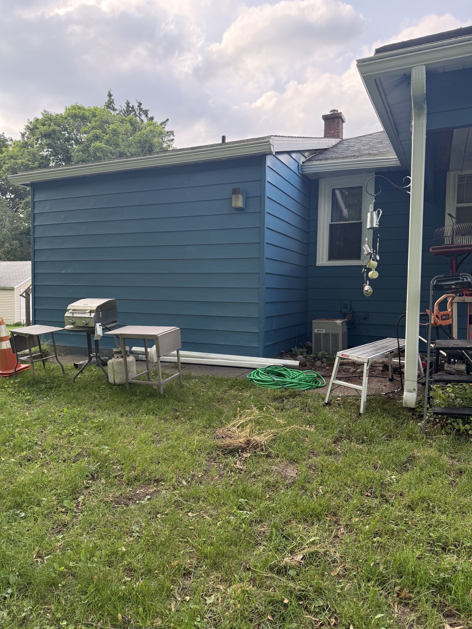 Blue home exterior after a Solid Ground painting project